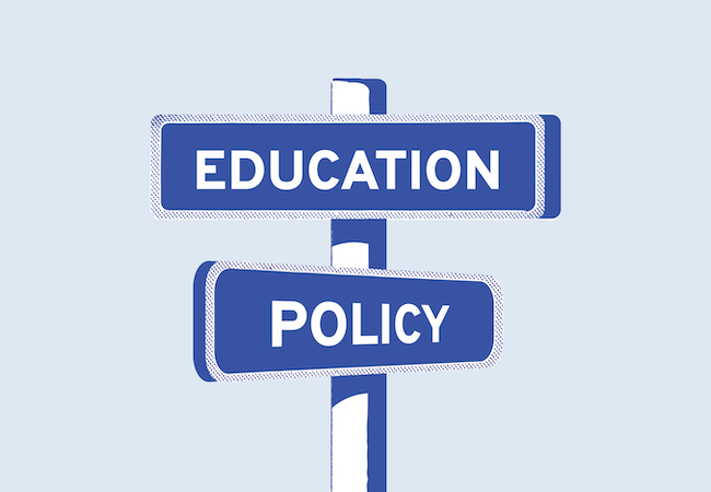 An illustration of street signs at an intersection that read "Education" and "Policy"
