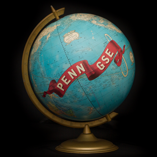 A globe with a Penn GSE ribbon painted on it.