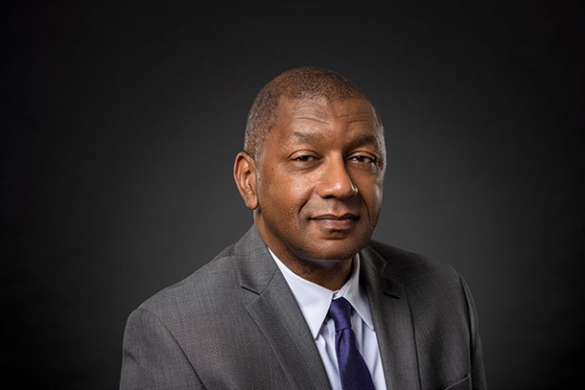 Headshot of Howard Stevenson against black background