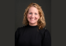 Janice Rafferty Grady  smiles at the camera wearing a black turtleneck