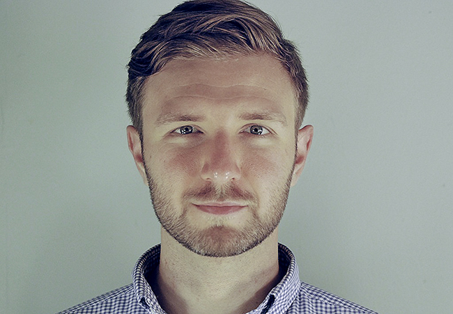 Man with beard and blue shirt.