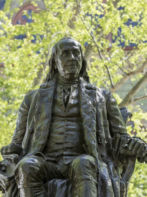 Statue of Ben Franklin outside College Hall.