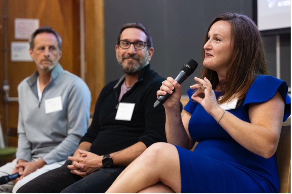 Lara Paparo seated alongside Thinkist executives Jared Wells and Mark Manasse, speaking into a microphone</span><span>