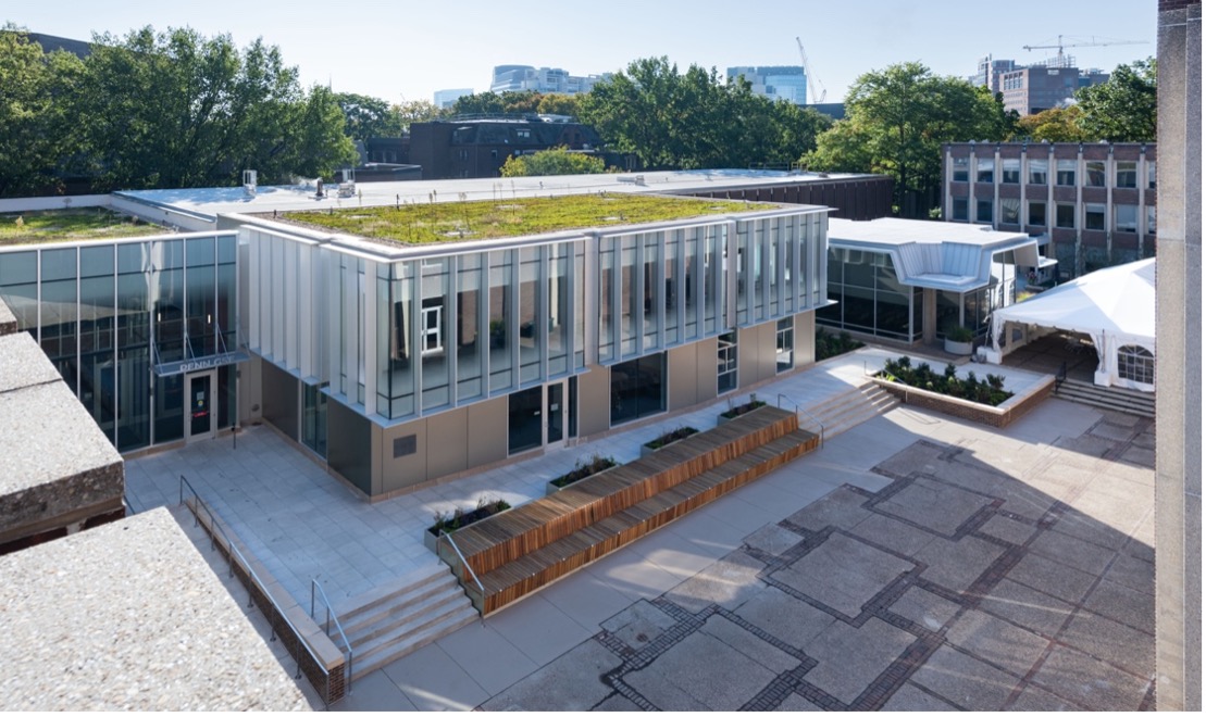 A view of the 2023 courtyard and lobby additions to the Penn GSE building from above, showing their green roofs and rear facade